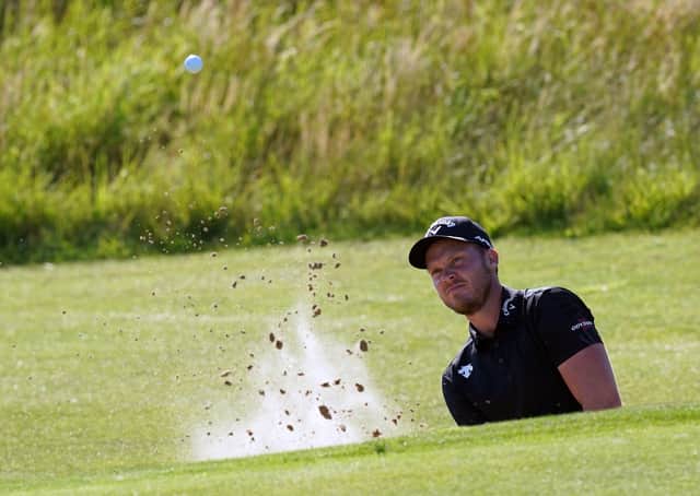 England's Danny Willett chips out of a bunker on the 6th. Picture: PA