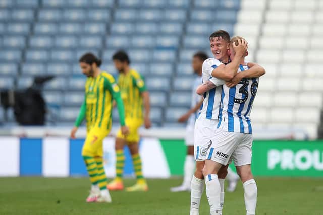 Huddersfield Town's Jonathan Hogg and Lewis O'Brien celebrate at full-time. PIC: Getty