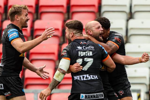 Castleford's Paul McShane celebrates with Jordan Turner, Alex Foster and Michael Shenton after scoring in the Challenge Cup semi-final against Warrington Wolves. Picture: Alex Whitehead/SWpix.com.