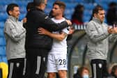 WINNING TEAM: Leeds United head coach Marcelo Bielsa, left, and outgoing former Whites defender Gaetano Berardi, right, share an embrace after Berardi's final game for Leeds against West Brom. Photo by Stu Forster/Getty Images.
