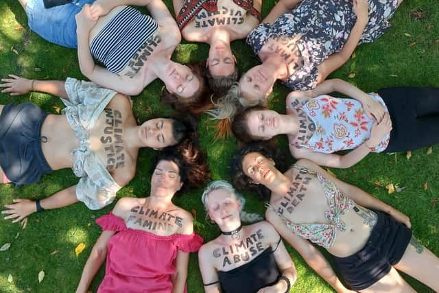 Extinction Rebellion protesters painted words about climate change on their chests. Image provided by Extinction Rebellion Leeds.