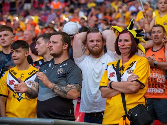 The pain of Wembley defeat shows on these Tigers fans' faces. Picture by Bruce Rollinson.