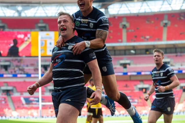 Craig Kopczak celebrates his Wembley try with Rovers teammate Nu Brown. Picture by Bruce Rollinson.
