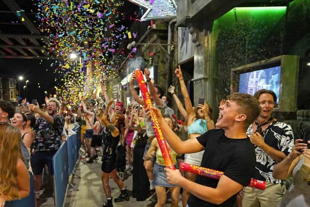 Clubbers queue to get into the Viaduct in Leeds on the first day that nightclubs could re-open after 16 months.