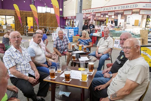 Former Tetley Brewery staff have a pint at The Duchess, part of The Yorkshire Square in Leeds Market.