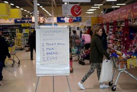 Remember this? A board displays shopping restrictions at a Tesco supermarket back in March 2020. PIC: Getty