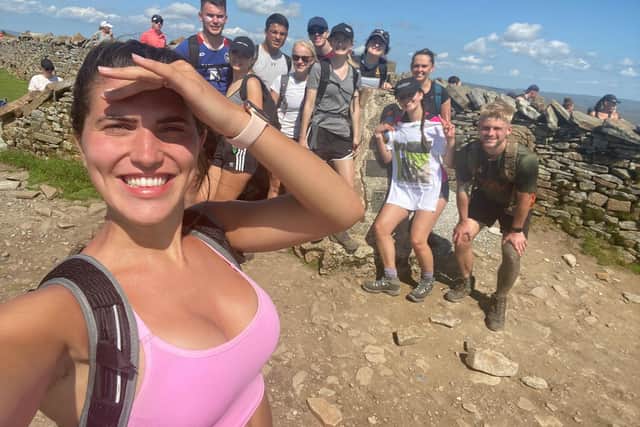 Lucy Dykes, 23, with friends and family completing the Three Peaks