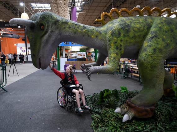 Keera Turner, 14, pictured with the Yorkshiresaurus at Kirkgate Market. PIC: Simon Hulme