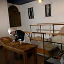 Florence Nightingale (Hannah Jones, Education and Outreach Officer) at the Thackray Medical Museum cleaning the operating table in the Victorian Operating Theatre.