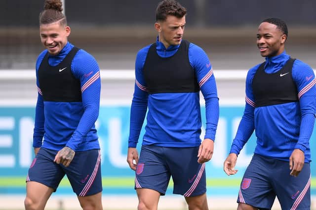 BACK TO IT: For Leeds United's England international midfielder Kalvin Phillips, left, pictured alongside Three Lions team mates Ben White, centre, and Raheem Sterling, right, during the Euros. Photo by Laurence Griffiths/Getty Images.