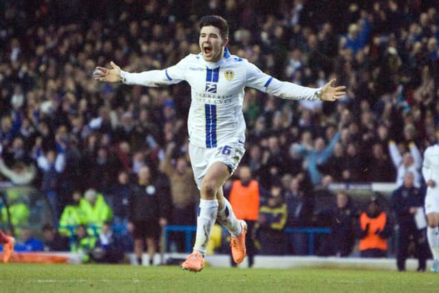 Alex Mowatt celebrates scoring his first goal for Leeds United. It came during a 5-1 win against Huddersfield Town at Elland Road in February 2014. PIC: Varley Picture Agency