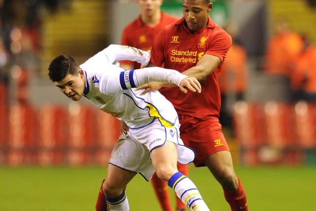 Captain Alex Mowatt shields the ball from Liverpool's Jordan Ibe during the FA Youth Cup fifth round clash at Anfield in February 2013.