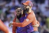 Friendly rival: England's Adil Rashid, congratulated by Moeen Ali on taking a return catch to dismiss Pakistan's Mohammad Rizwan, takes on Jonny Bairstow.