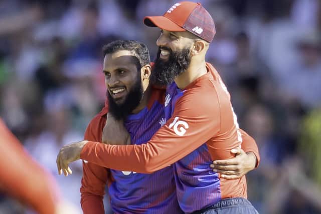 Friendly rival: England's Adil Rashid, congratulated by Moeen Ali on taking a return catch to dismiss Pakistan's Mohammad Rizwan, takes on Jonny Bairstow.