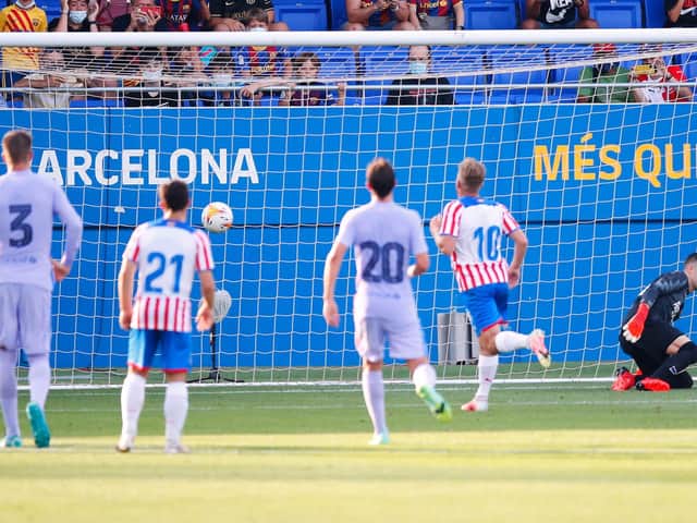 AUDACIOUS: Former Leeds United playmaker Samu Saiz nets with his Panenka style penalty kick in Saturday's pre-season friendly for Girona against Barcelona. Photo by Eric Alonso/Getty Images.