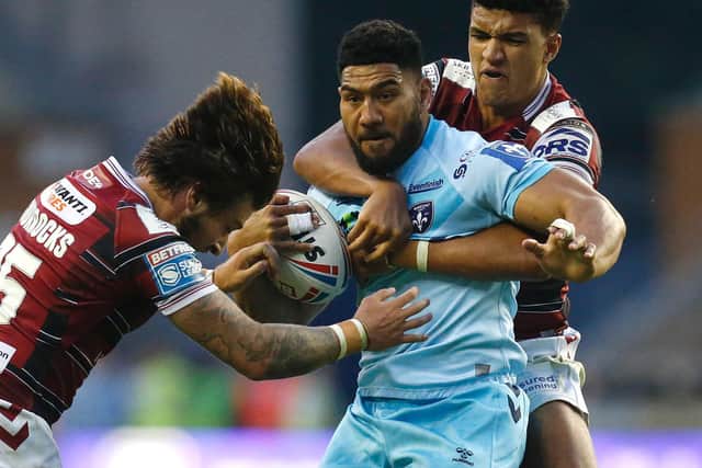 Wakefield Trinity's Kelepi Tanginoa is held. (ED SYKES/SWPIX)