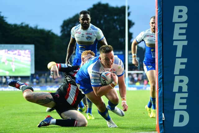 Between the sticks: Rhinos' Callum McLelland goes over to score agaionst Salford. Picture: Jonathan Gawthorpe