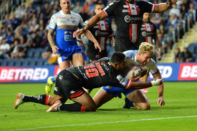 Deal me in: Matt Prior celebrates his new Leeds contract with a try. Picture: Jonathan Gawthorpe