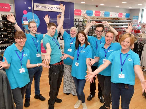 The Cancer Research UK team welcome customers.