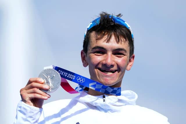 Alex Yee celebrates with his silver medal after the Men's Triathlon at the Odaiba Marine Park. PIC: Martin Rickett/PA Wire