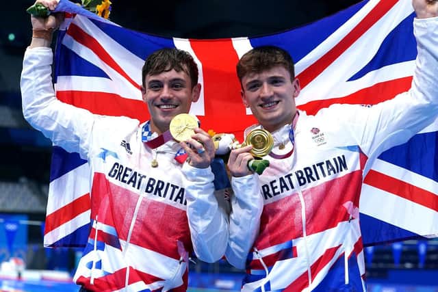 Tom Daley (left) and Leeds's own Matty Lee celebrate winning gold in the Men's Synchronised 10m Platform Final at the Tokyo Aquatics Centre. PIC: PA