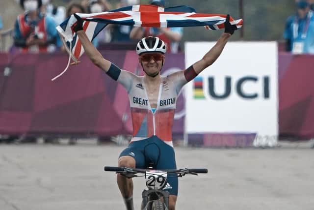 Leeds's won Tom Pidcock celebrates as he crosses the finish line to win the gold medal during the men's cross country mountain bike competition. PIC: PA