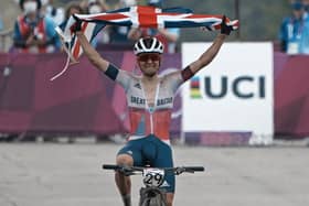 Leeds's won Tom Pidcock celebrates as he crosses the finish line to win the gold medal during the men's cross country mountain bike competition. PIC: PA