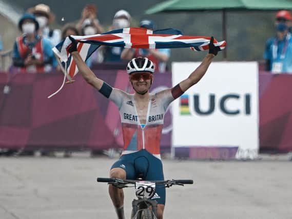 Leeds's won Tom Pidcock celebrates as he crosses the finish line to win the gold medal during the men's cross country mountain bike competition. PIC: PA