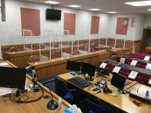 A court room at Leeds Crown Court with acrylic screens