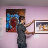 Marek Romaniszyn, assistant community curator with the Mixed Notes exhibition in the community corridor at Leeds City Museum.

 Picture: Tony Johnson