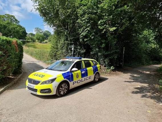 The scene near Ilkley as police cordoned off an area following the discovery of a suspected wartime mortar shell near to train tracks. Picture: BTP