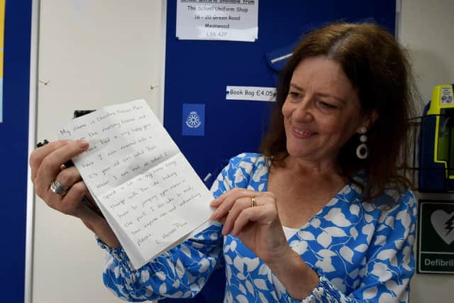 Retiring early years teacher, Christine Harrison-Place, with the letter she placed in the school time capsule in 1992.