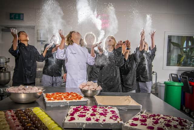 Oonagh (in white) and her sister Jenny (right of Oonagh) pictured with The Marshmallowist team in their Farsley kitchen