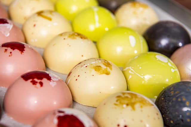 The gourmet teacakes are hand-painted into chocolate moulds and filled with handcrafted caramels or jams
