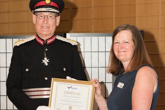 LYPFT Chief Executive Sara Munro receiving the accreditation certificate from Her Majesty’s Lord Lieutenant of West Yorkshire, Ed Anderson