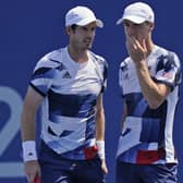 HEADING OUT: Joe Salisbury, right, and Andy Murray talk during their men's doubles quarter-finals match in Tokyo. Picture: AP/Seth Wenig