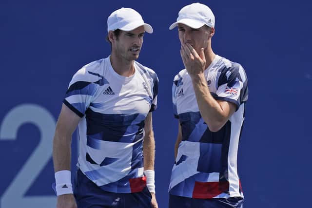 HEADING OUT: Joe Salisbury, right, and Andy Murray talk during their men's doubles quarter-finals match in Tokyo. Picture: AP/Seth Wenig