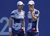 HEADING OUT: Joe Salisbury, right, and Andy Murray talk during their men's doubles quarter-finals match in Tokyo. Picture: AP/Seth Wenig