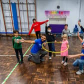 Children enjoying a drama class run by Alex Dunlop, left, pictured with Art Camp UK director Jon Wiltshire, right