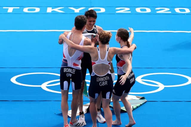 VICTORY: Alex Yee celebrates with his Great Britain teammates after crossing the line in first. Picture: Getty Images.