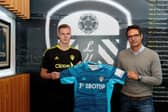 SIGNED: Kristoffer Klaesson, left, with Leeds United's head of European recruitment Gabby Ruiz, right. Picture by LUFC.
