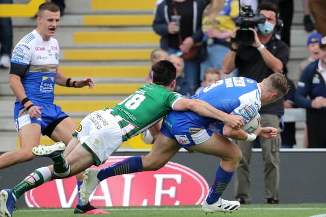Off we go: Leeds Rhinos' Harry Newman (right) scores his side's first try of the game. Picture: Richard Sellers/PA Wire.