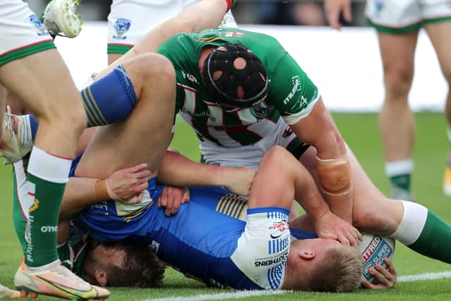 Tight fit: Leeds Rhinos' Mikolaj Oledzki managed to get the ball down for his side's second try of the game. Picture: Richard Sellers/PA Wire.