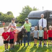 Pupils from Yeadon Westfield Infant School reception class, Mrs Sharp (a teacher at the school), Fargo the pony, Hope Pastures volunteer Sue Saracun, and Matthew Pank, Manning Stainton’s Guiseley branch manager..