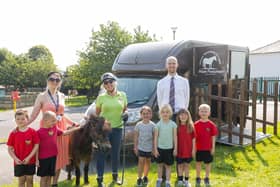 Pupils from Yeadon Westfield Infant School reception class, Mrs Sharp (a teacher at the school), Fargo the pony, Hope Pastures volunteer Sue Saracun, and Matthew Pank, Manning Stainton’s Guiseley branch manager..