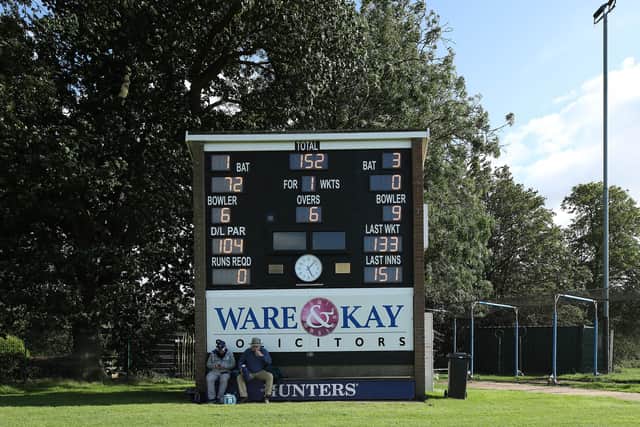 Modern look: Spectators under the scoreboard at Clifton Park, York. Picture by John Clifton/SWpix.com