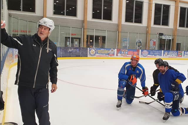 Leeds Knights' head coach Dave Whistle runs through a training drill at Planet Ice Leeds on Monday night.