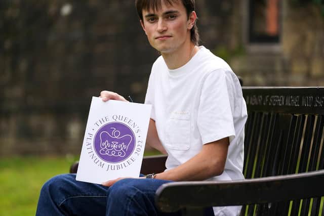 Edward Roberts with his winning design for The Queen's Platinum Jubilee Emblem Competition. Picture: Jacob King/PA Wire