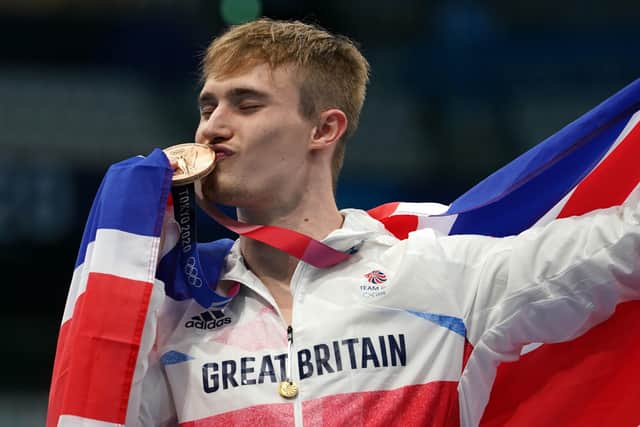 Yorkshire's Jack Laugher celebrates on the podium with the bronze medal for the Men's 3m Springboard at Tokyo Aquatics Centre. Picture: PA