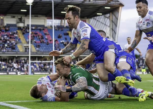 Hard to take:  Leeds's Brad Dwyer and Richie Myler thought they had prevented Warrington's Josh Charnley from scoring a try, but the referee and video ref thought otherwise. Picture by Allan McKenzie/SWpix.com
